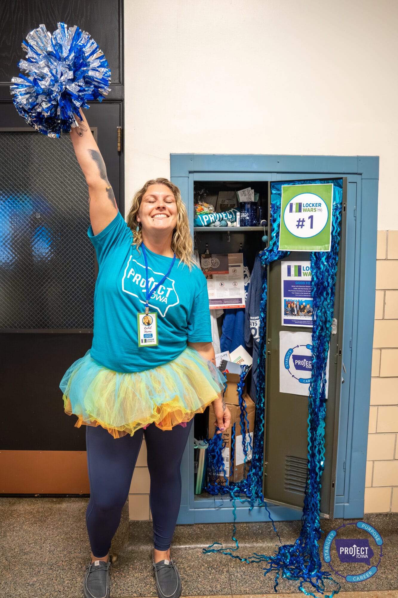 Rachel standing by a locker