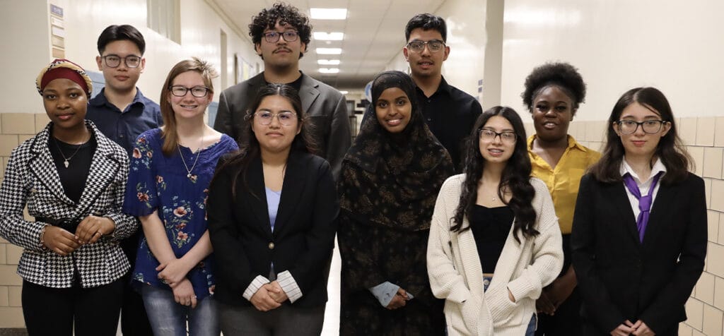Diverse group of high school students dressed in business attire