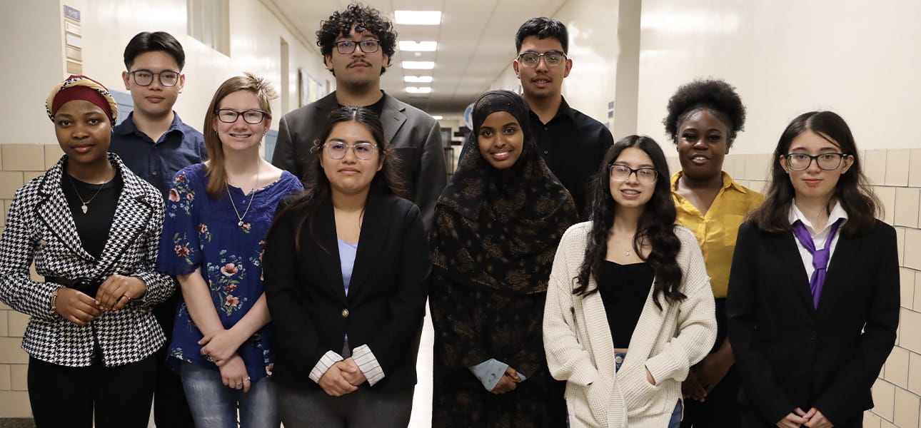 Diverse group of high school students dressed in business attire