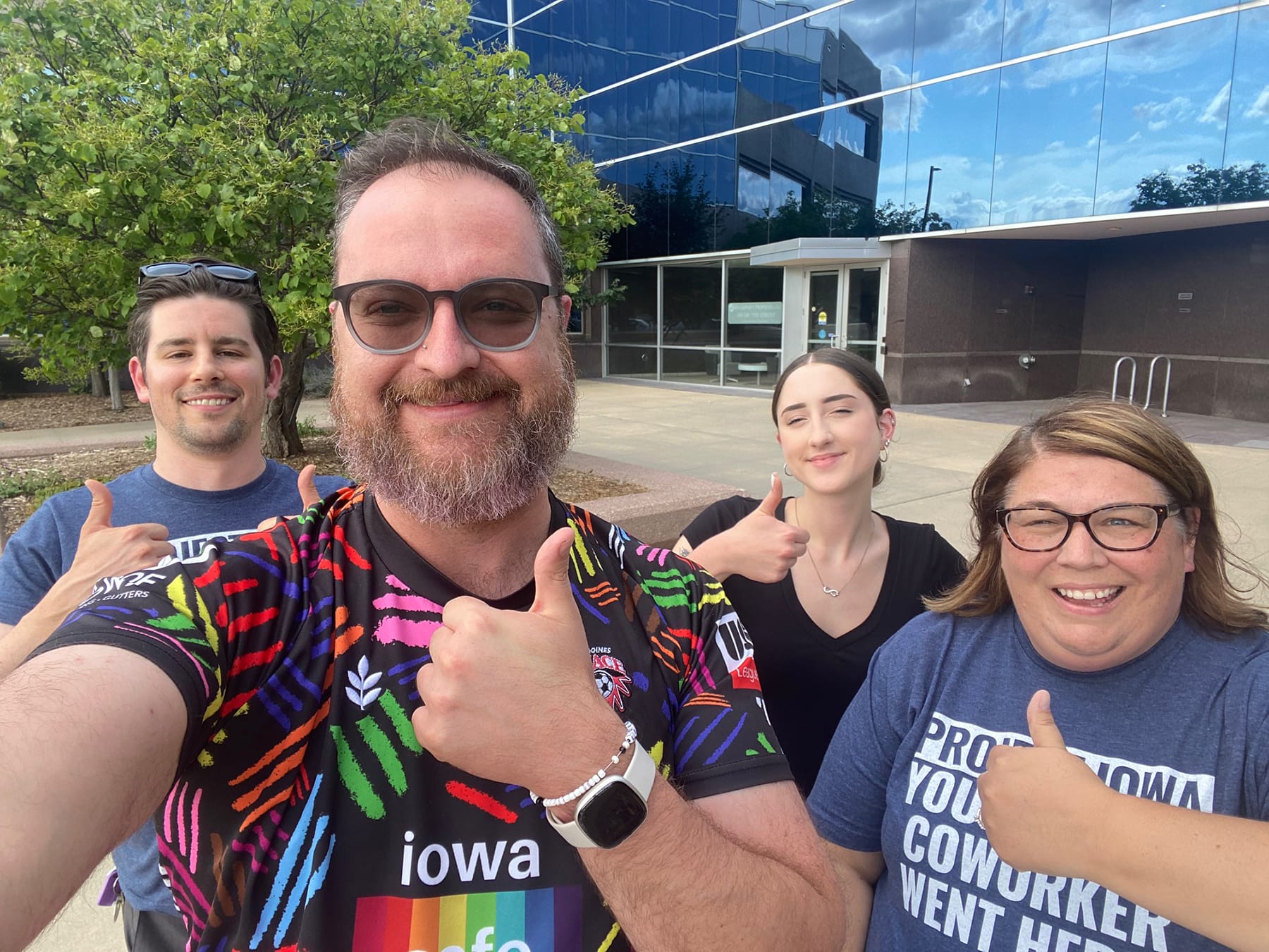 Group of people giving a thumbs up